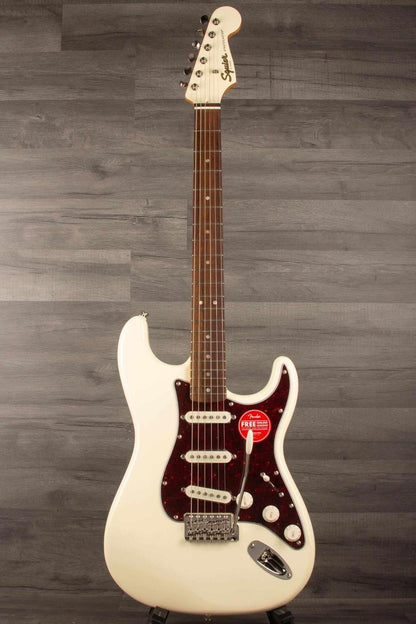 Squier FSR Classic Vibe '60s Stratocaster in Olympic white with three pickups and vintage tremolo system.