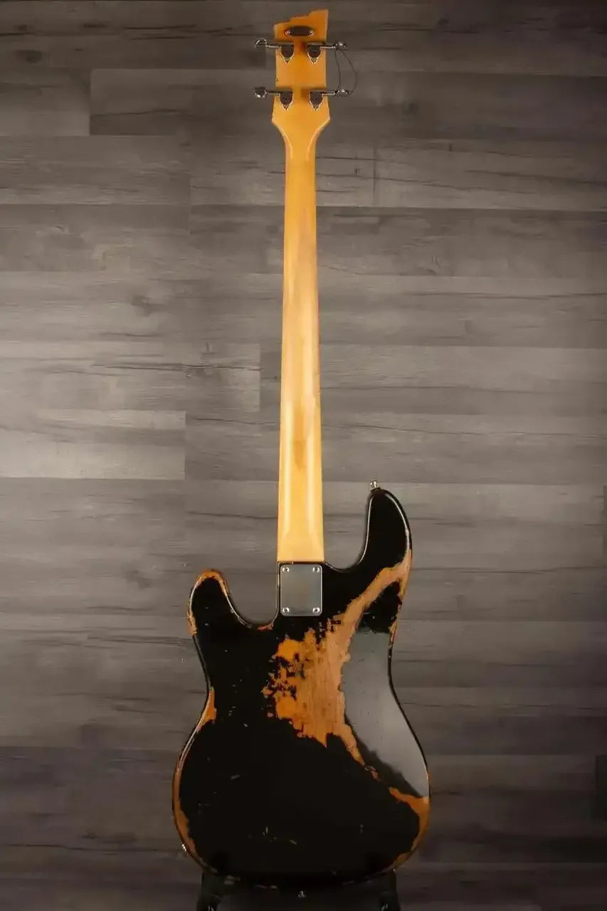 Duesenberg Chris Chaney Bass Black Distressed LTD back view showcasing unique finish and craftsmanship.