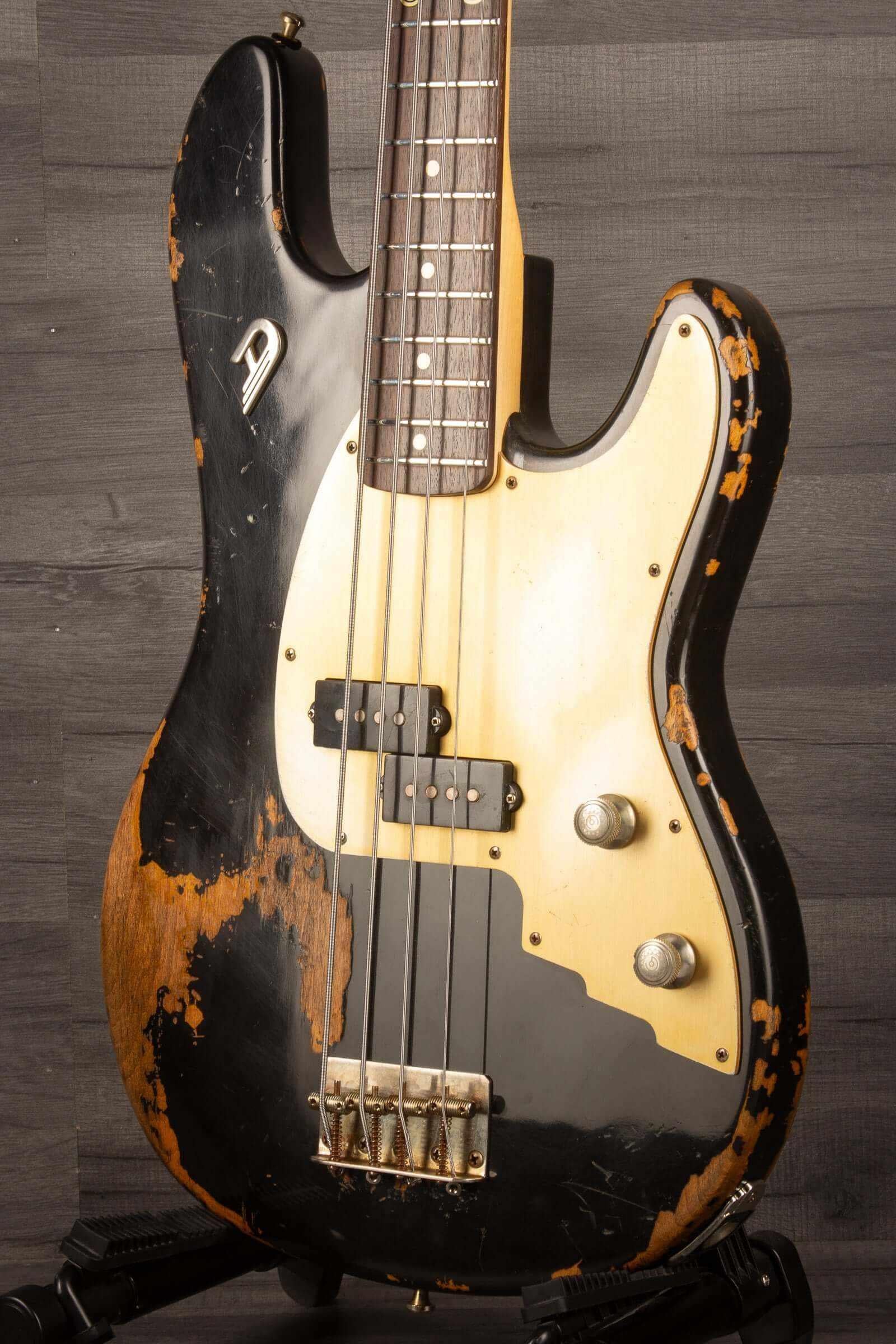 Duesenberg Chris Chaney Bass Black Distressed LTD showcasing its unique distressed finish and sleek design.