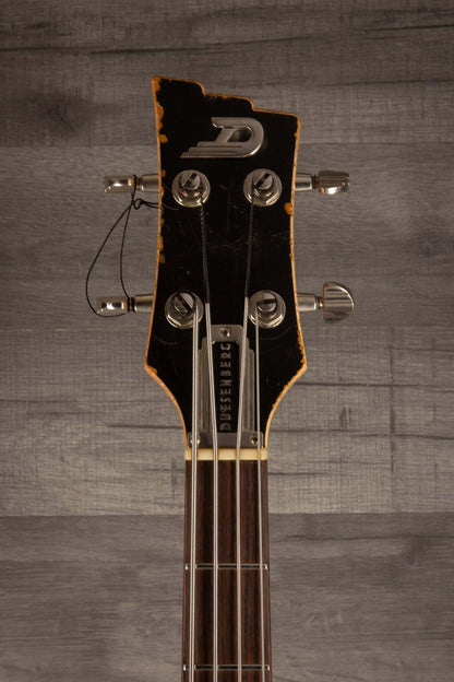Duesenberg Chris Chaney Bass Black Distressed LTD headstock with vintage finish and tuning pegs
