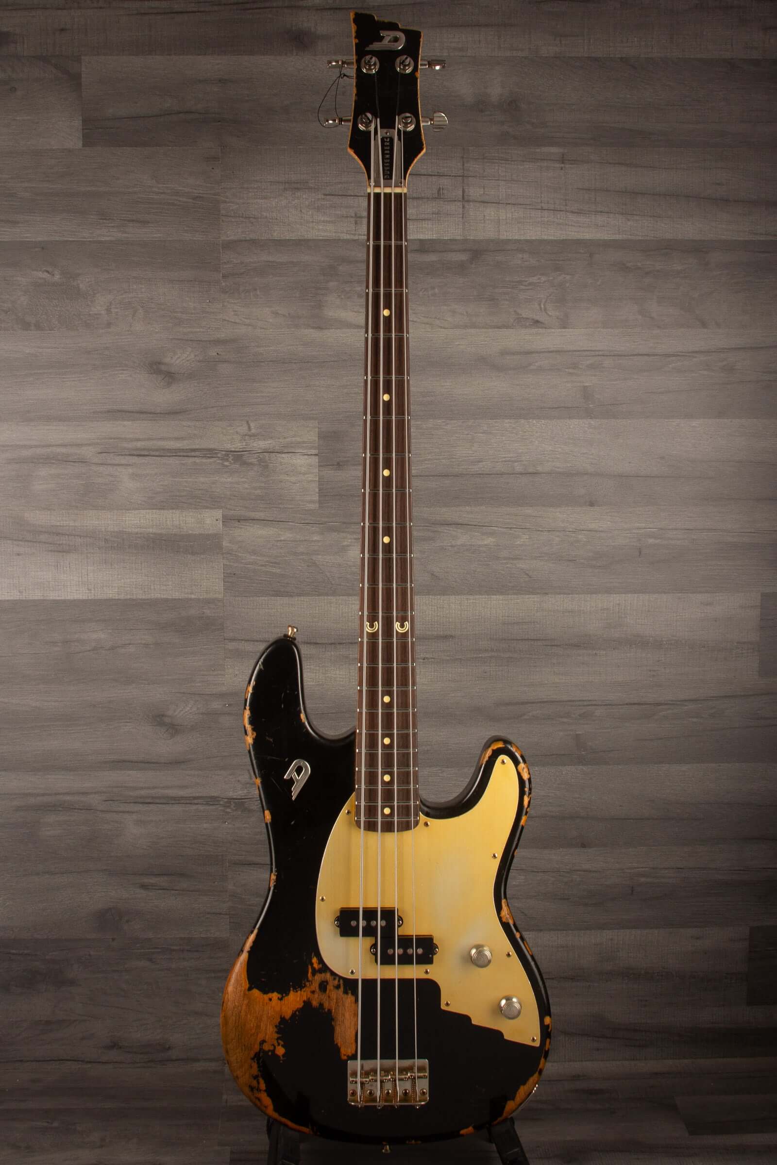 Duesenberg Chris Chaney Bass Black Distressed LTD showcasing a vintage design and unique finish on a solid Alder body.