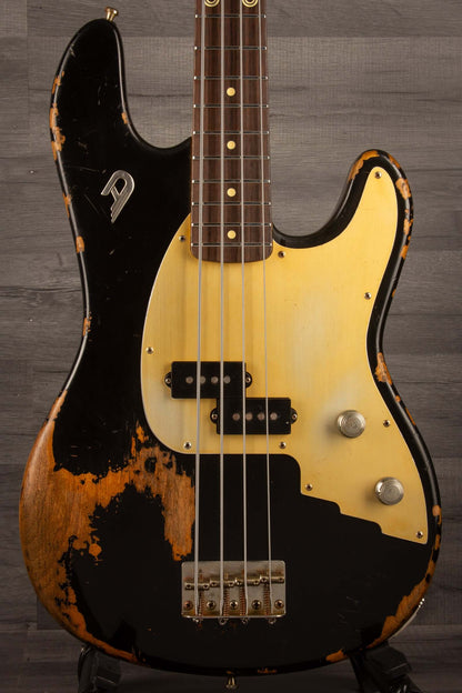 Duesenberg Chris Chaney Bass Black Distressed LTD close-up view showcasing vintage finish and unique features.