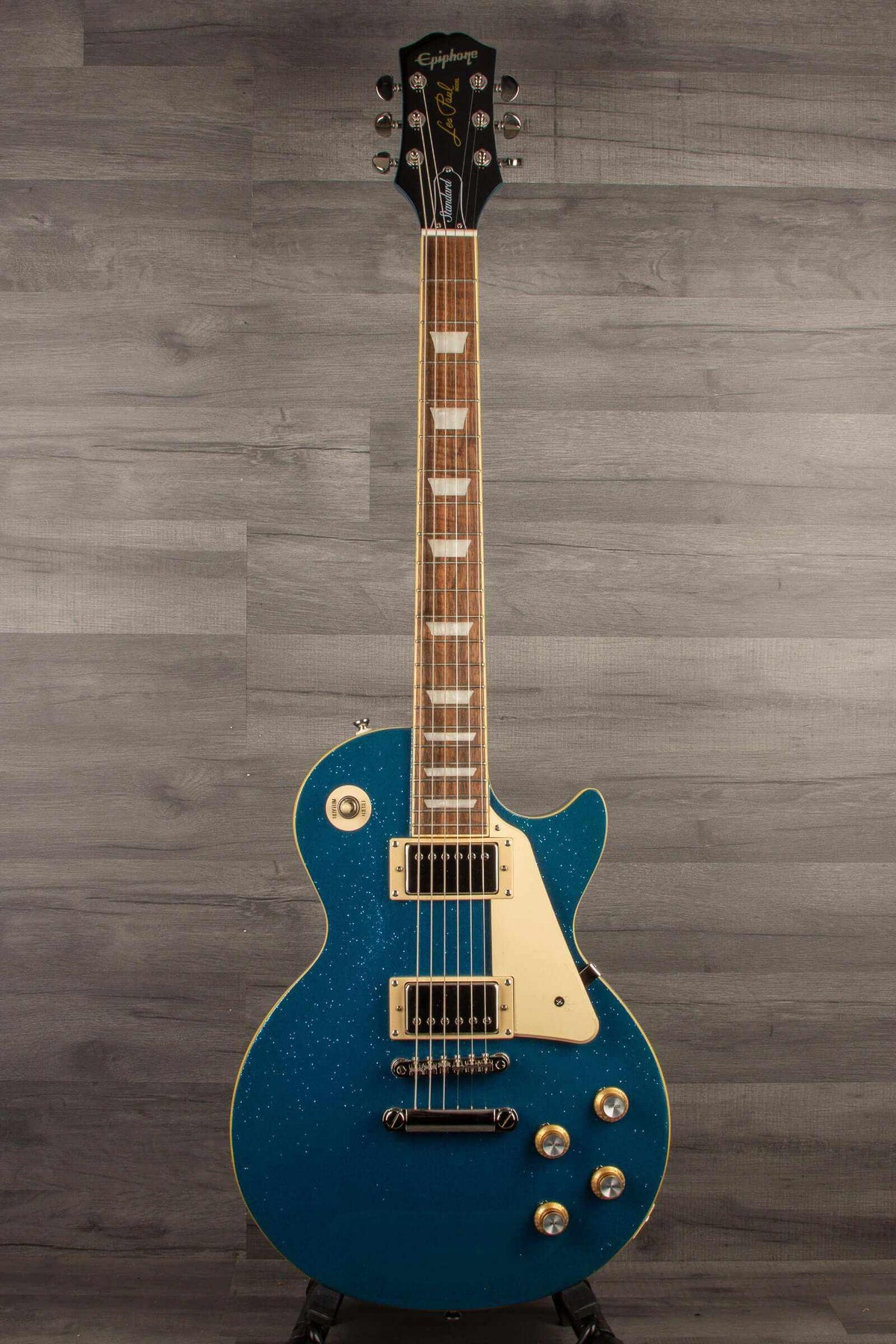 Epiphone Les Paul Standard 60's Brunswick Blue Sparkle electric guitar with premium gig bag, showing its striking design and features.