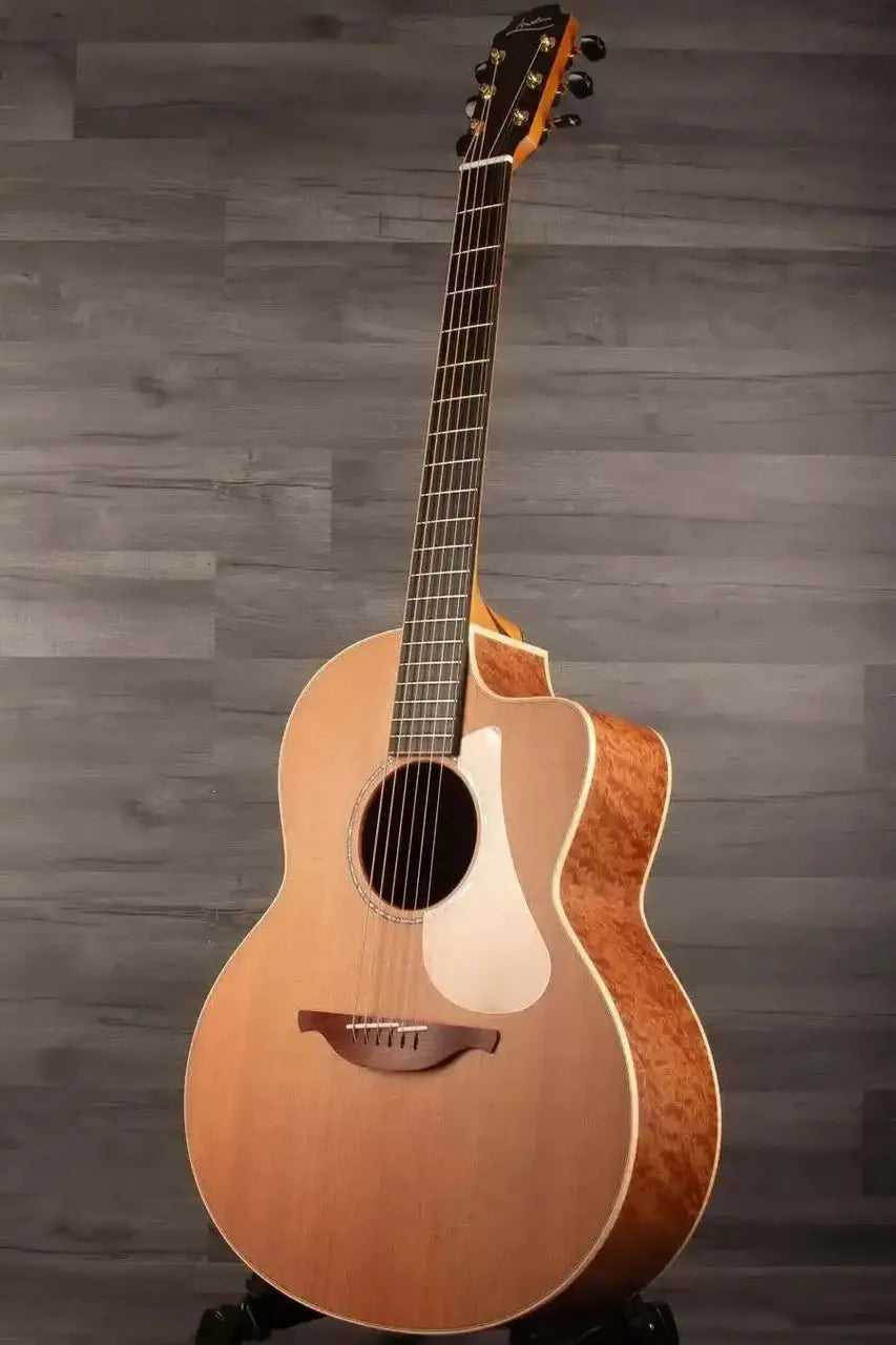 Lowden F-35C Quilted Mahogany / Buckskin Redwood acoustic guitar showcasing rich wood textures and craftsmanship.