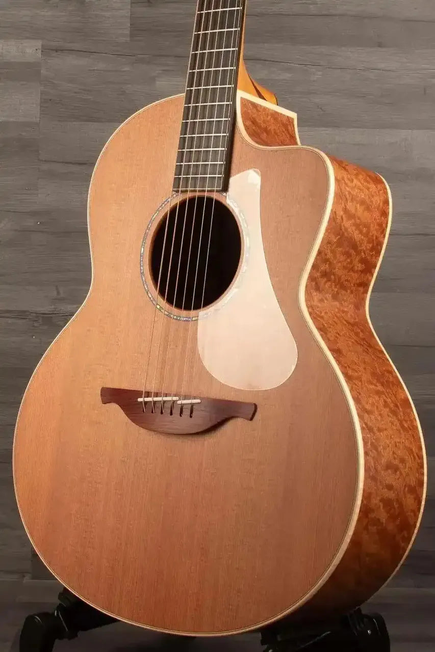 Lowden F-35C Quilted Mahogany / Buckskin Redwood guitar showcasing elegant design and premium woods.