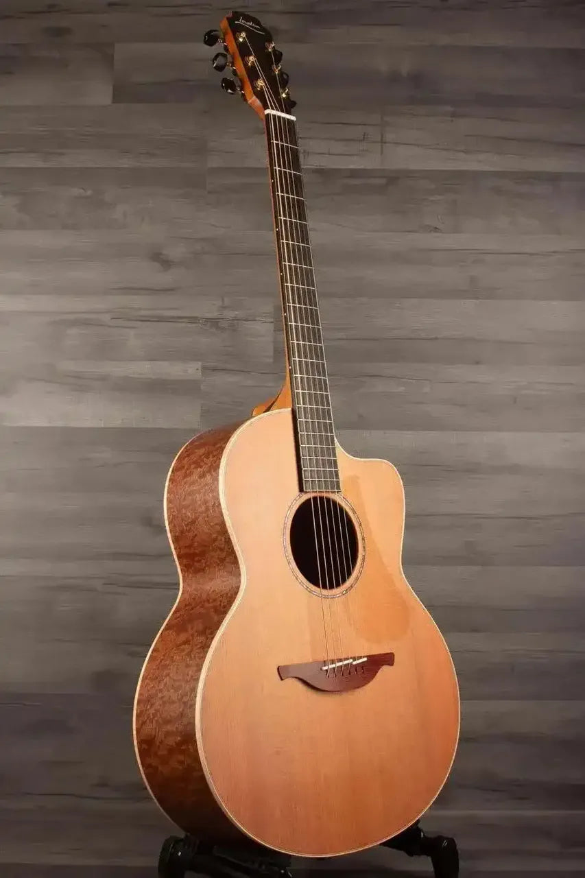 Lowden F-35C Quilted Mahogany / Buckskin Redwood acoustic guitar, showcasing AAAA Quilted Mahogany back and AAAA Buckskin Redwood soundboard.