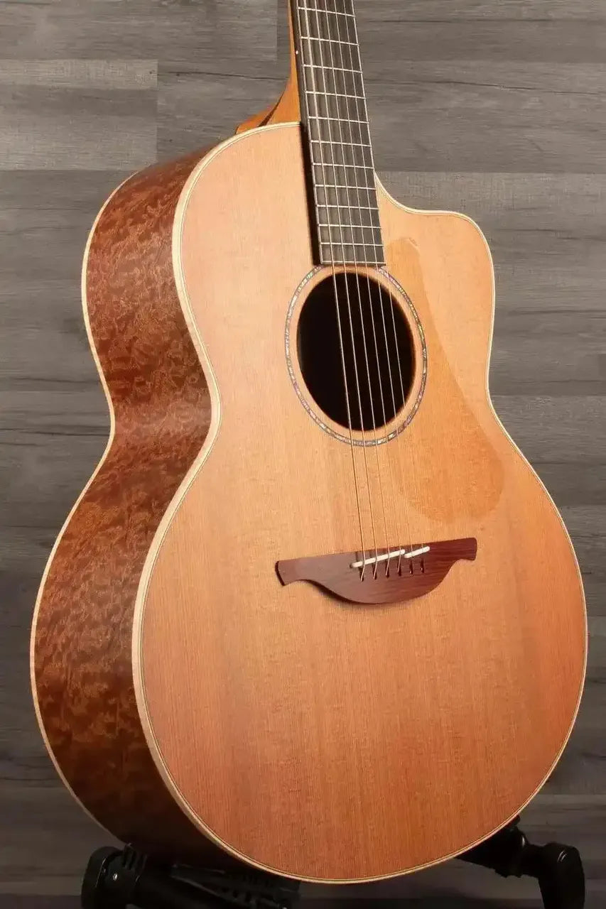 Lowden F-35C Quilted Mahogany / Buckskin Redwood guitar showcasing AAAA Quilted Mahogany back and AAAA Buckskin Redwood soundboard.