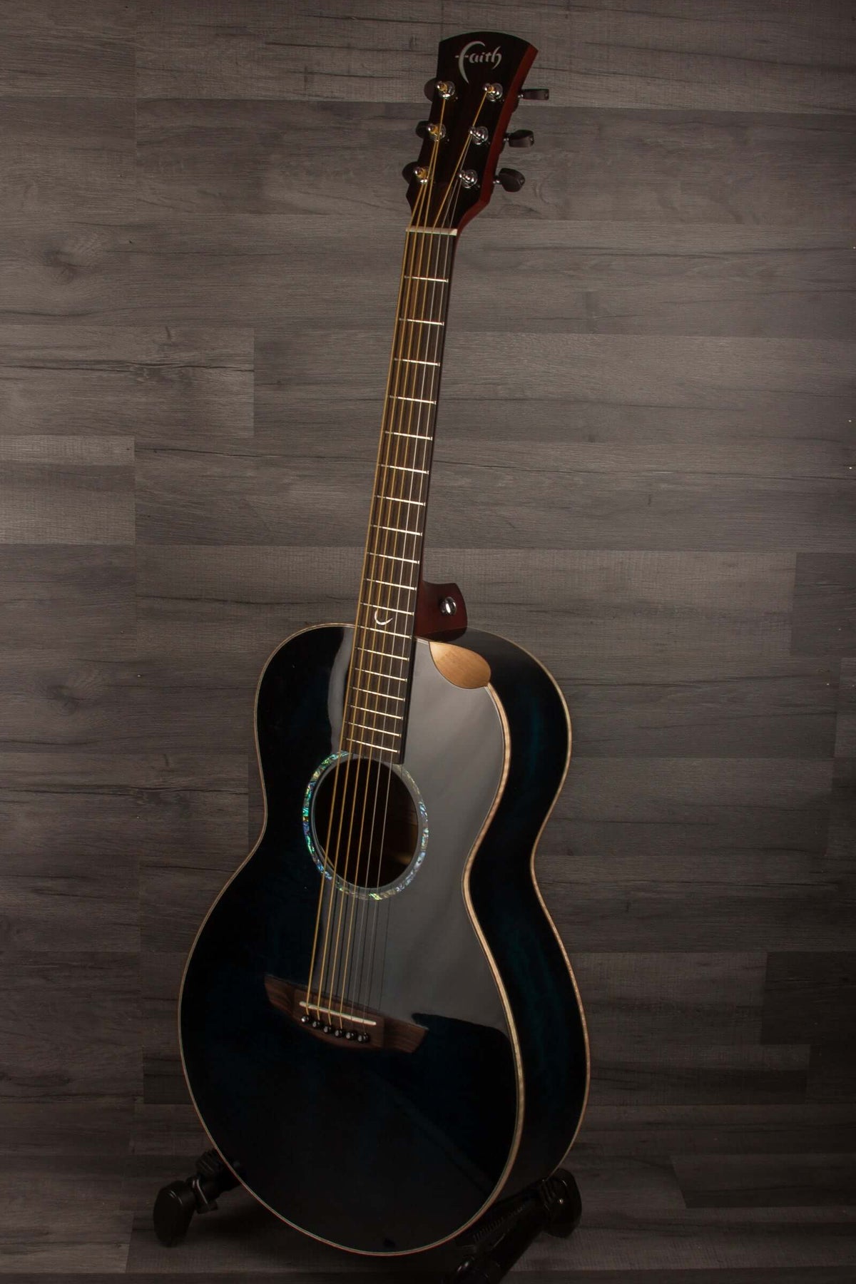 Faith BLUE MOON Series Mercury E Scoop Inc Case displayed on a stand, showcasing its unique blue wood finish.