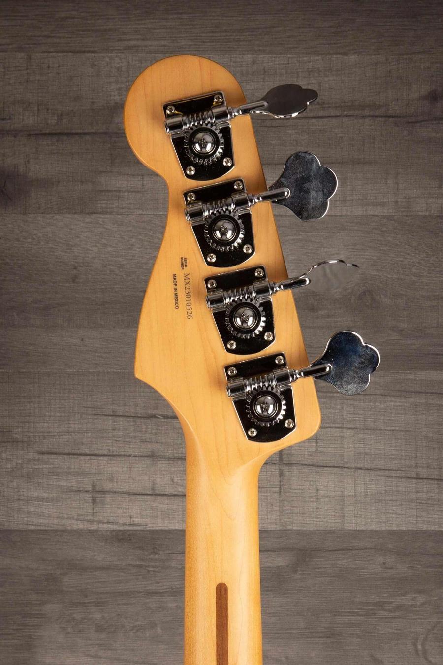 Fender Player Jazz Bass Guitar, Maple neck, 3 tone sunburst headstock with tuning pegs and vintage styling.