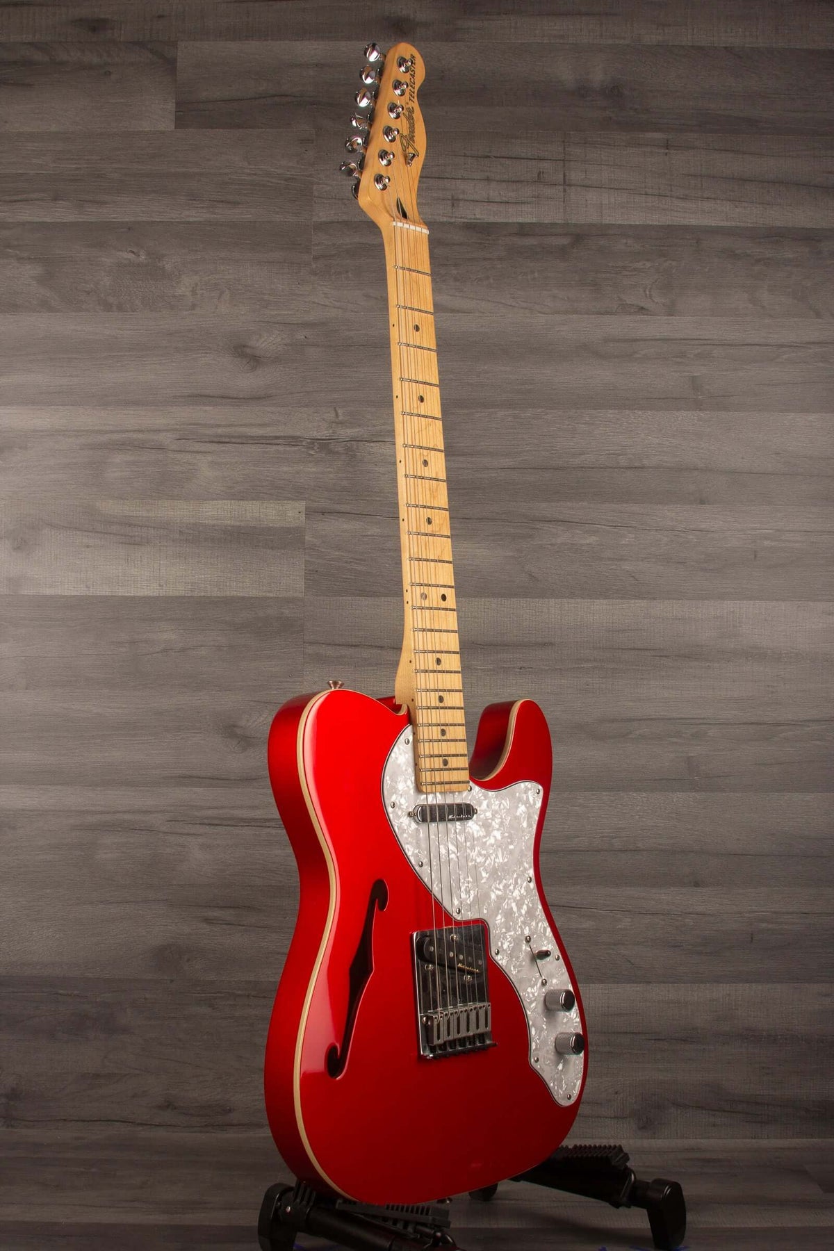 USED - Fender Deluxe Telecaster Thinline, Maple Fingerboard, Candy Apple Red on display against a gray backdrop.