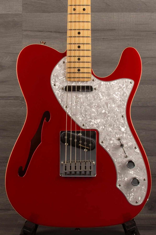 USED - Fender Deluxe Telecaster Thinline, Maple Fingerboard, Candy Apple Red guitar with a light red finish.