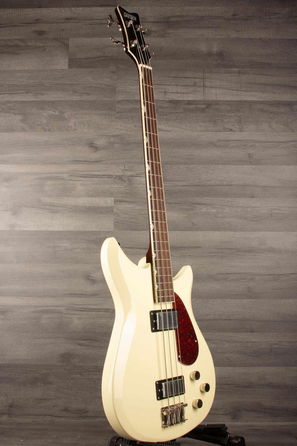 Gretsch   Electromatic® CVT Bass Double-Cut, Laurel Fingerboard, Vintage White side view on wooden background.