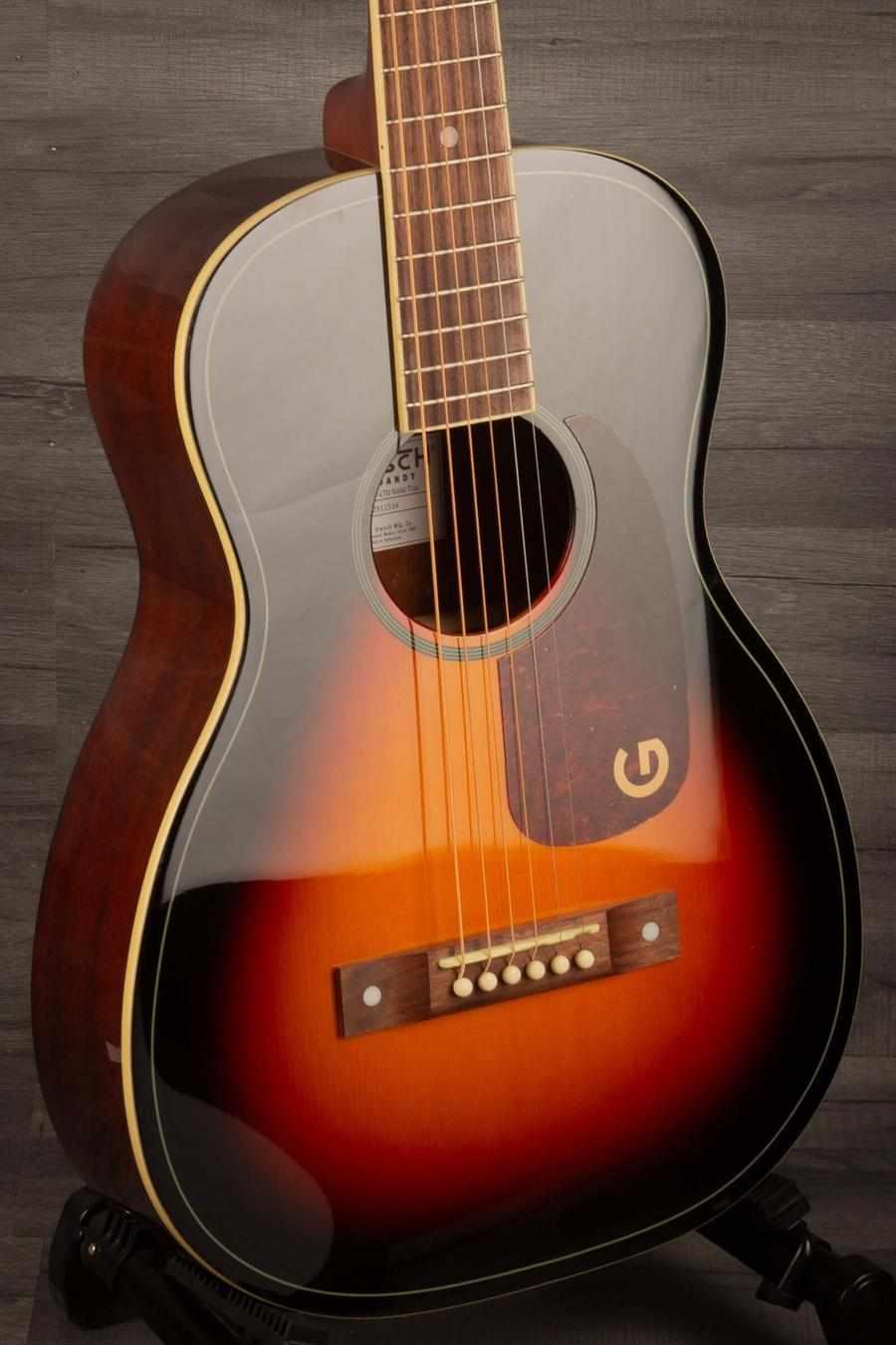 Gretsch Jim Dandy Parlor guitar with deep cherry burst finish and black pickguard on display.