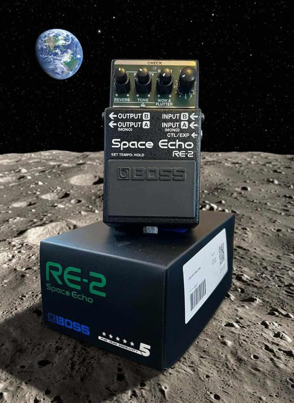 USED Boss RE-2 pedal on the moon with Earth in the background, highlighting its unique design and features.