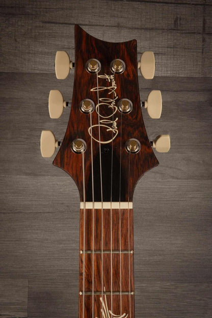 Close-up of the headstock of the USED - PRS Paul's Guitar Dark Cherry Sunburst featuring intricate inlays and tuning pegs.