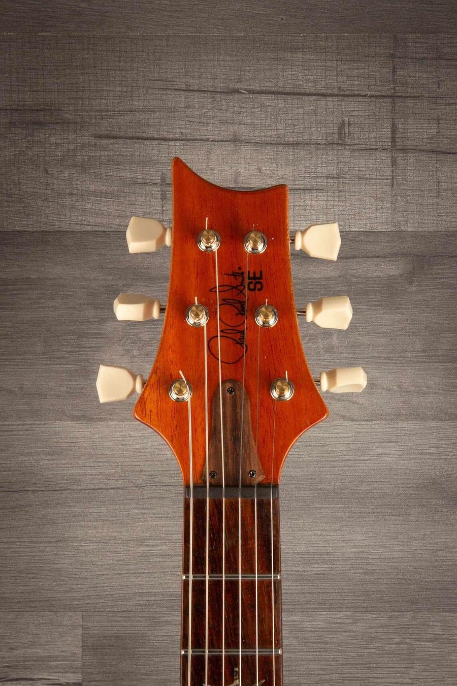 USED - PRS SE Paul’s Guitar Electric Guitar - Faded Blue Burst headstock with tuning pegs and signature.