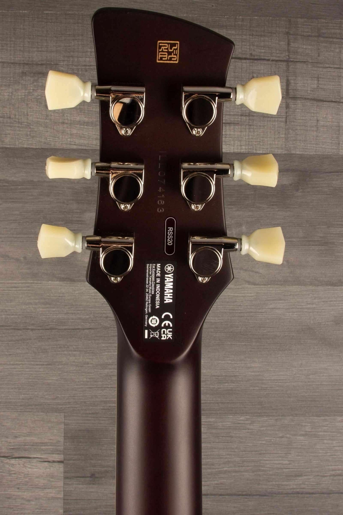Yamaha RSS20 Revstar - Mist Green guitar headstock showing tuning pegs and brand logo.
