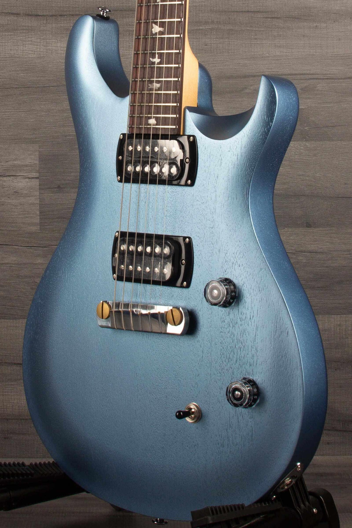PRS SE CE24 Standard Stoptail in ice blue metallic finish showcasing its sleek design and controls.