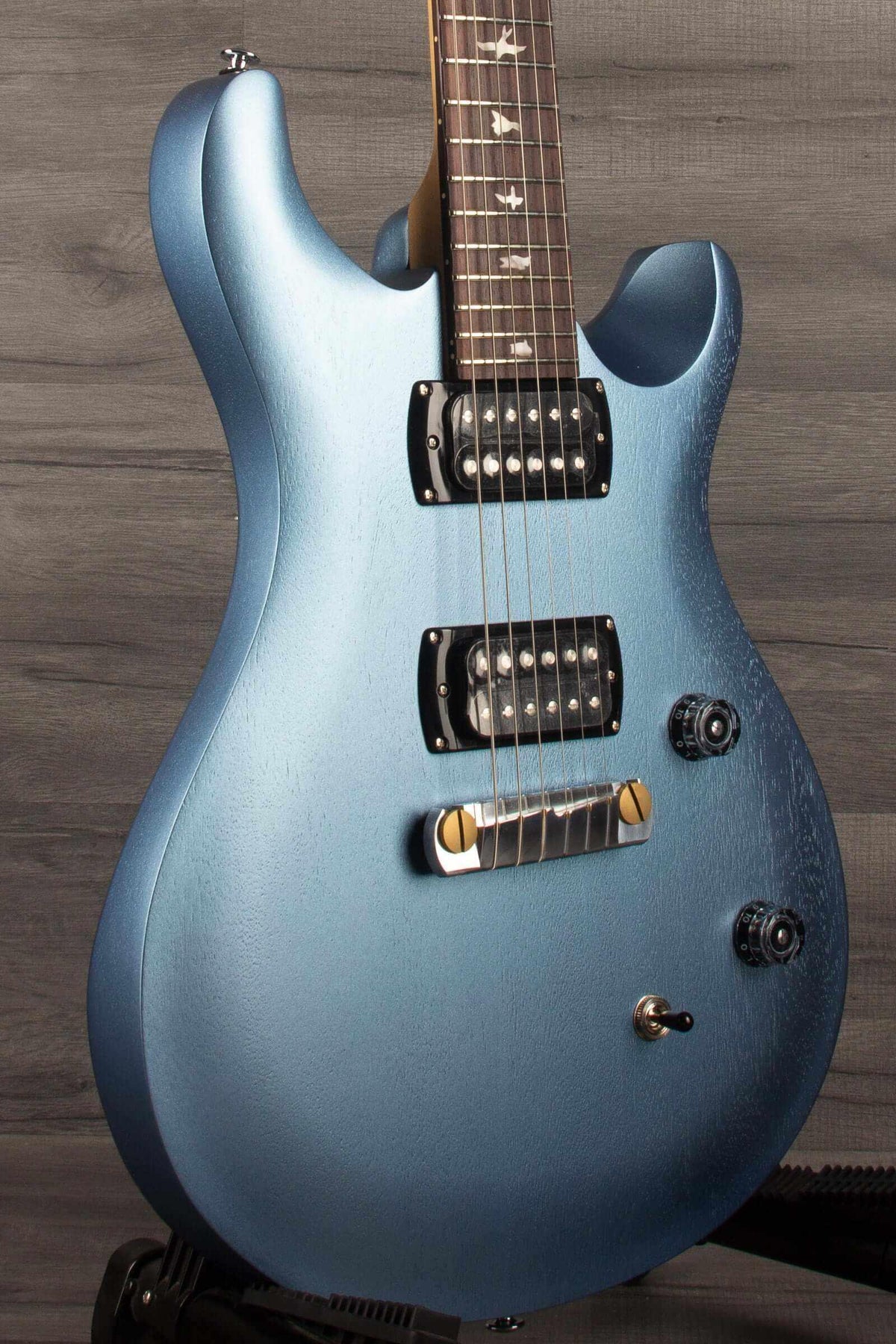 PRS SE CE24 Standard Stoptail guitar in ice blue metallic finish, showcasing sleek design and quality craftsmanship.