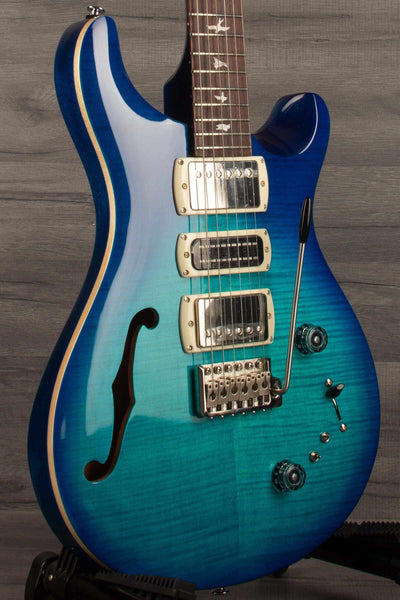 PRS SE Special Semi Hollow - Lake Blue guitar showcasing its semi-hollow body and stunning blue finish.