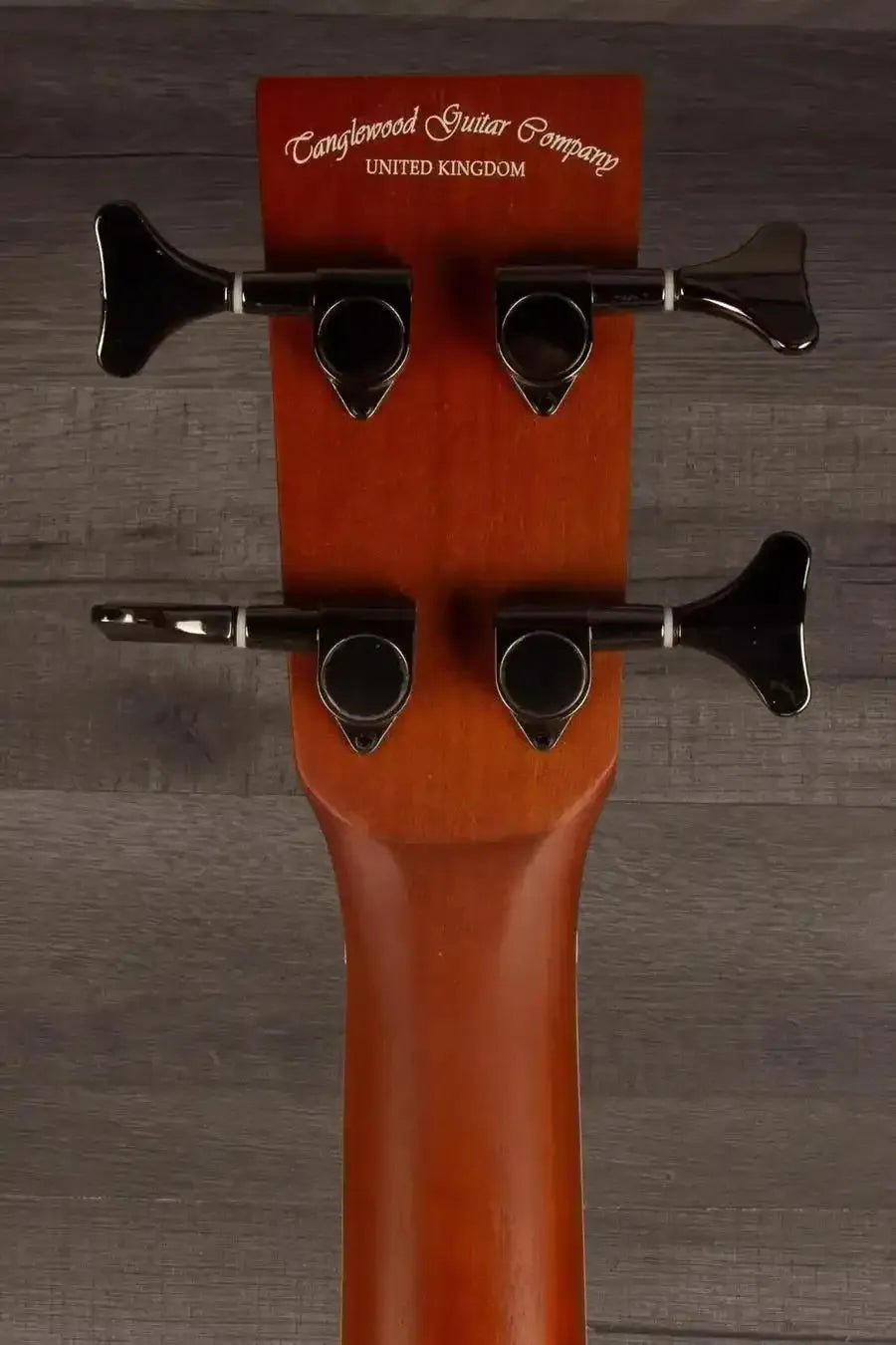 Tanglewood TRPROABBW Acoustic - Bass Guitar headstock with tuning pegs and company logo from Tanglewood Guitar Company.