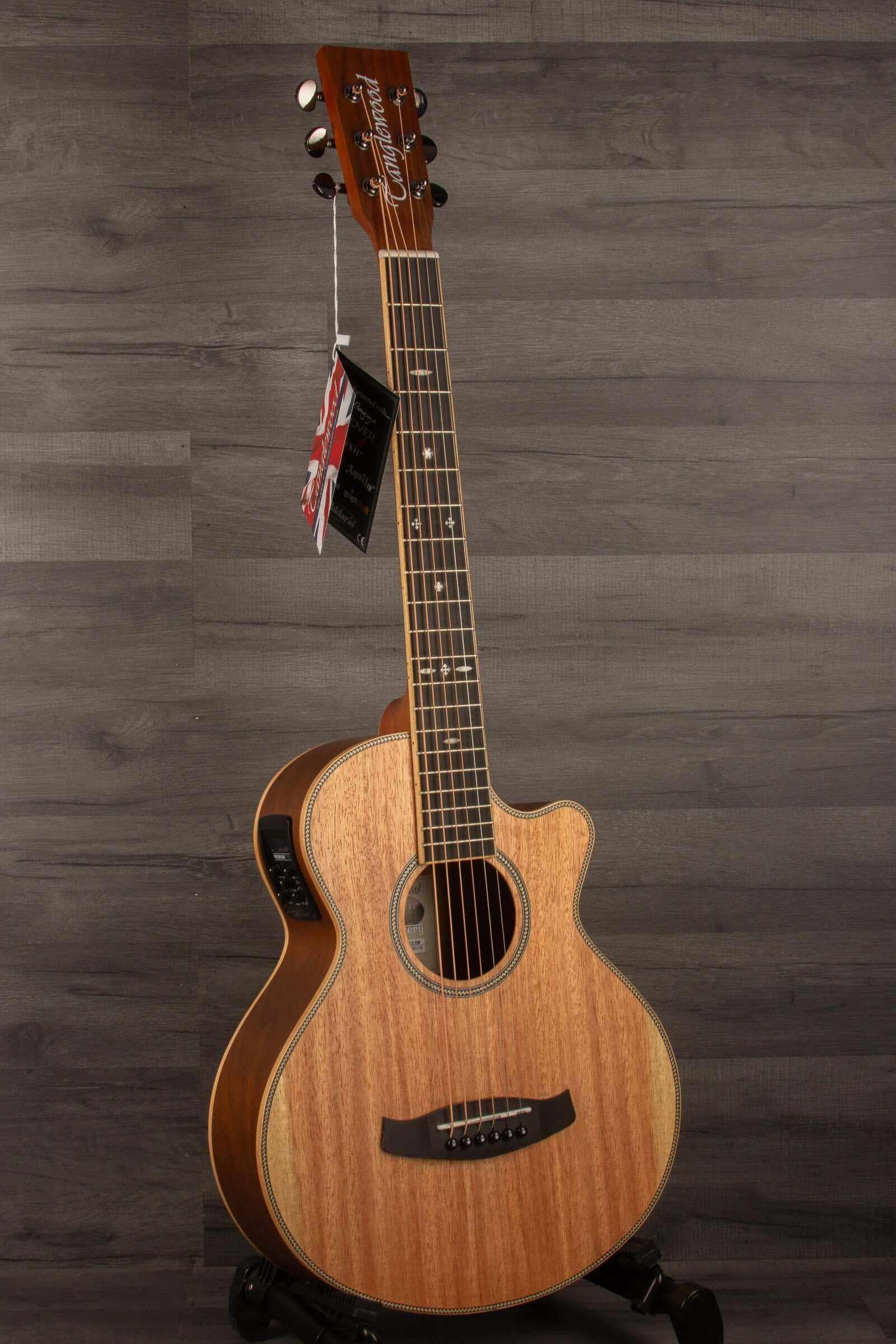 Tanglewood DBT-TCEBW Travel Super Folk Electro Acoustic guitar with a natural wood finish on a gray background.