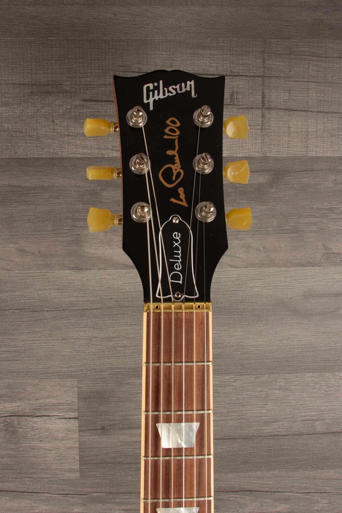 Gibson 2015 Les Paul Deluxe Gold Top guitar headstock with G FORCE tuning system and detailed inlays.