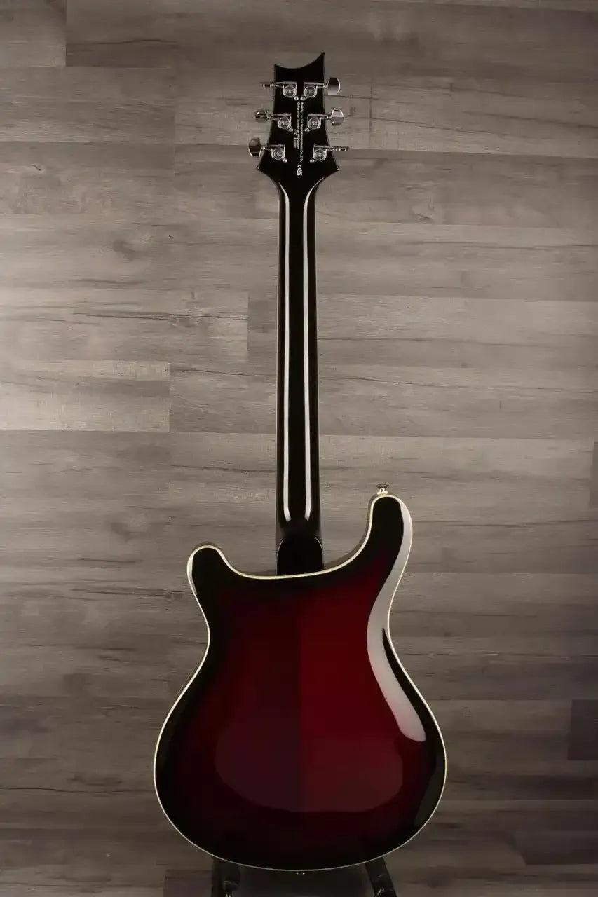 Back view of USED - PRS SE Hollowbody Standard Fire Red Burst guitar showcasing the mahogany body and sleek design.