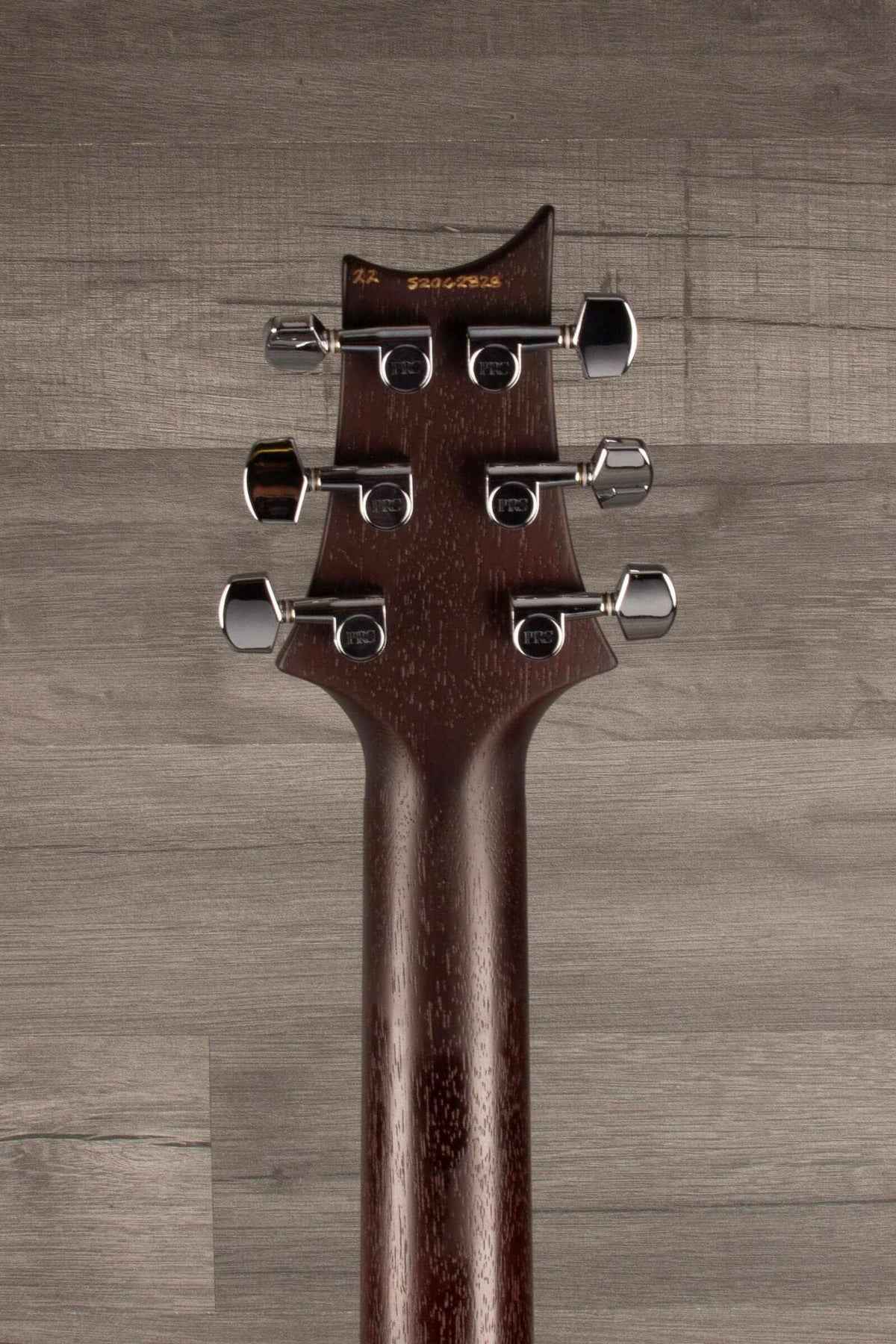 PRS S2 Standard 24 Satin guitar headstock showcasing tuners and mahogany neck detail.