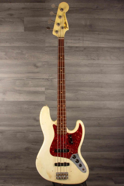 USED Fender Custom shop 64 Jazz Bass in good condition with original bridge and pickup covers.