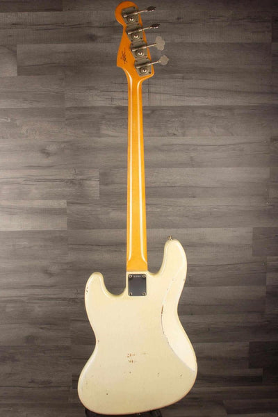 USED Fender Custom shop 64 Jazz Bass back view, showcasing heavy relic design and vintage finish.