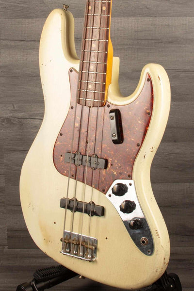 USED Fender Custom shop 64 Jazz Bass with heavy relic finish and original bridge/pickup covers.