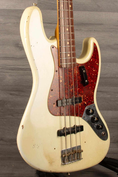 USED Fender Custom shop 64 Jazz Bass with heavy relic finish, original covers included.