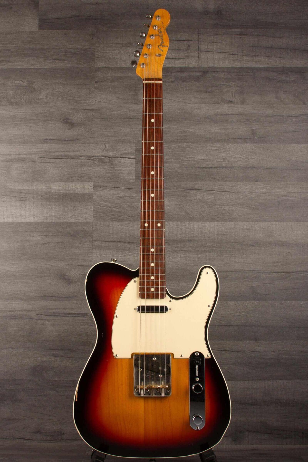 Fender Japanese Traditional II 51 Nocaster used guitar in 3-tone sunburst finish on a wooden background.