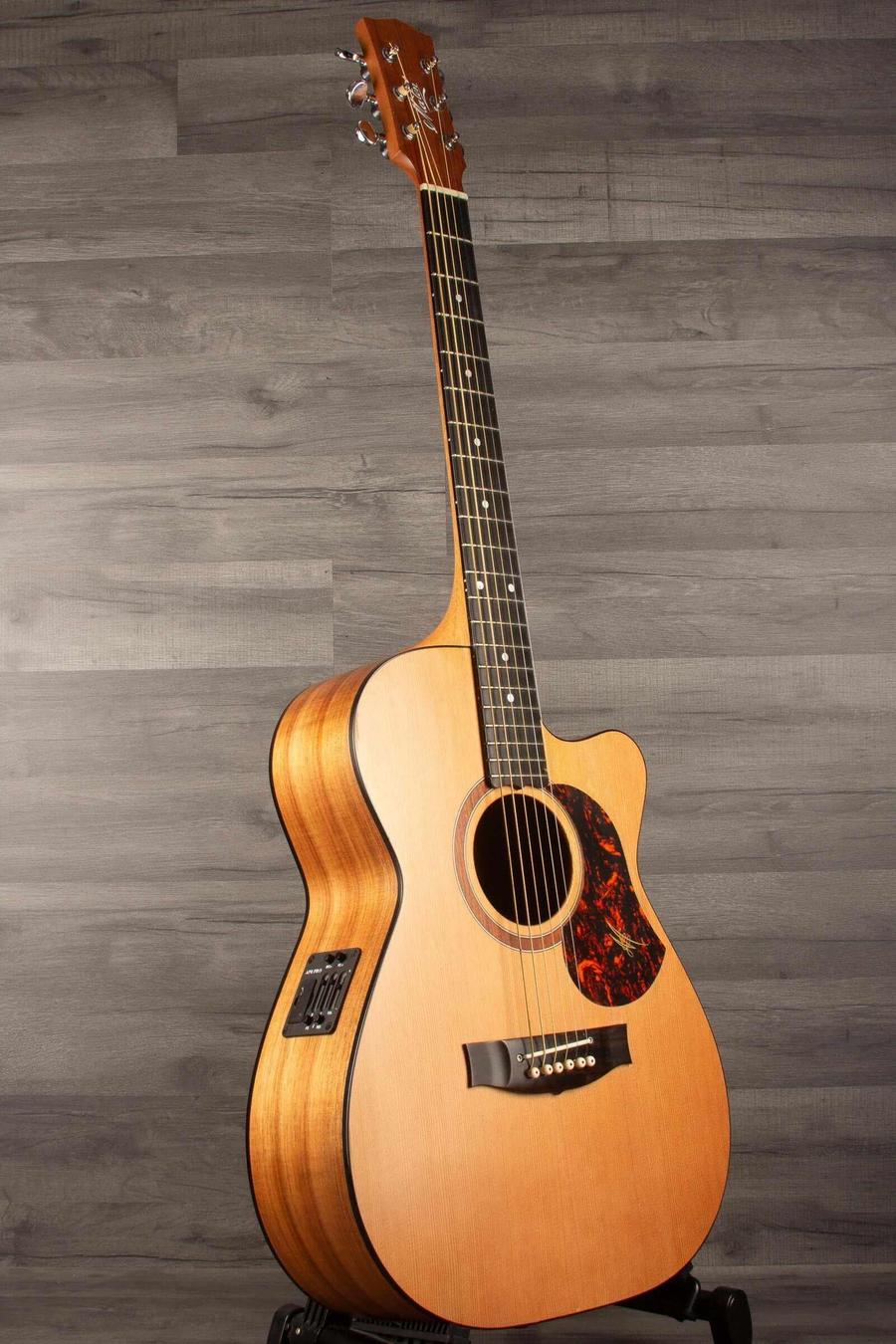 USED - Maton SRS808C Acoustic Guitar With AP5 Pro Pickup System displayed on a stand against a wooden backdrop.