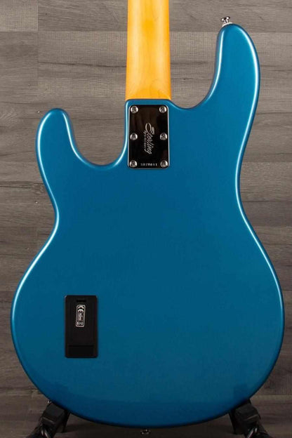 USED - Sterling by Music Man Stingray Ray24 Bass Guitar - Toluca Lake Blue back view showcasing the vibrant color and neck.