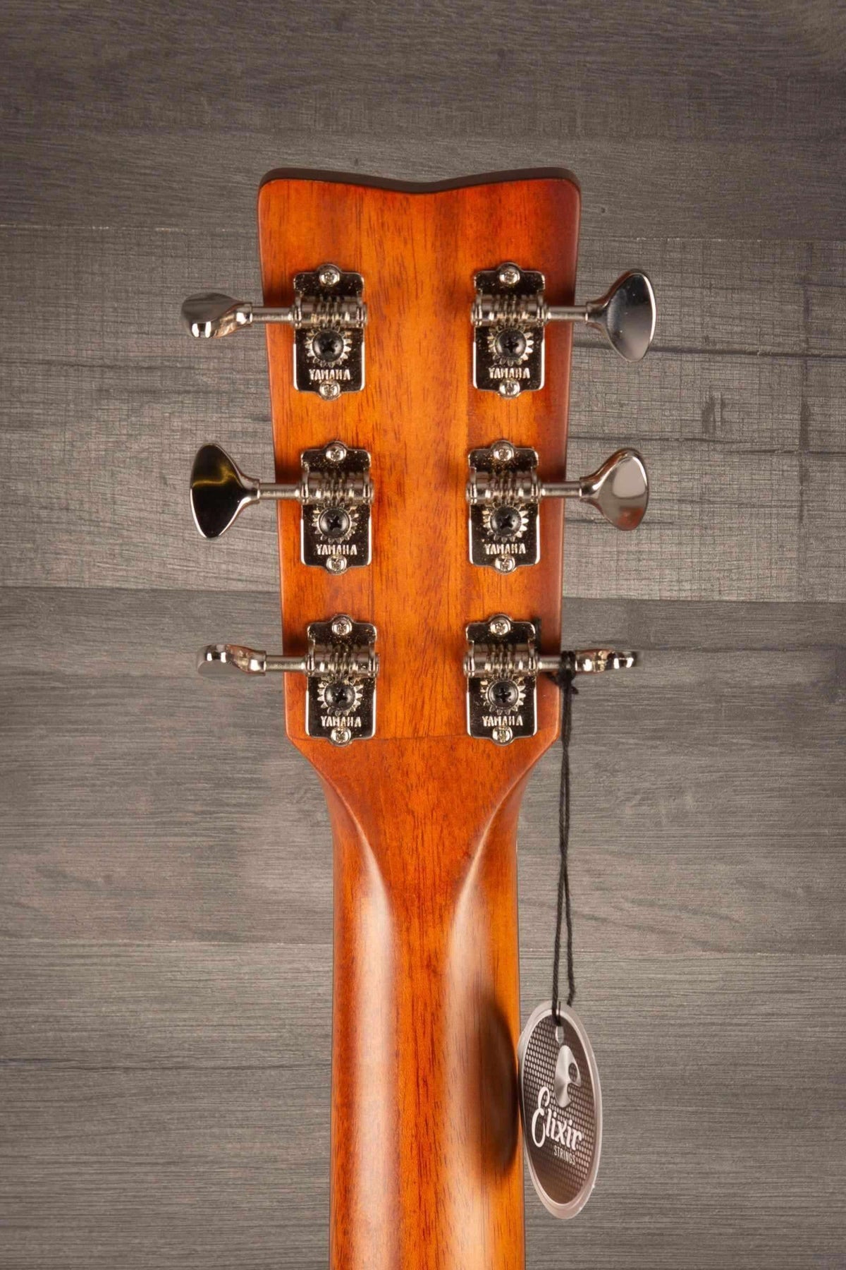 Close-up of the headstock and tuning pegs of a Yamaha FSX3 II electro acoustic guitar.