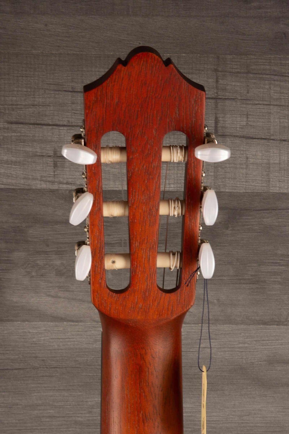 Yamaha CG122MS classical guitar headstock showcasing tuning pegs, highlighting its affordable classical guitar craftsmanship.