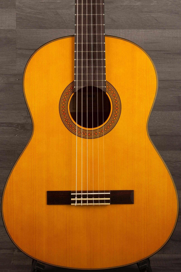 Yamaha CG122MS affordable classical guitar showing its beautiful body and intricate design details.
