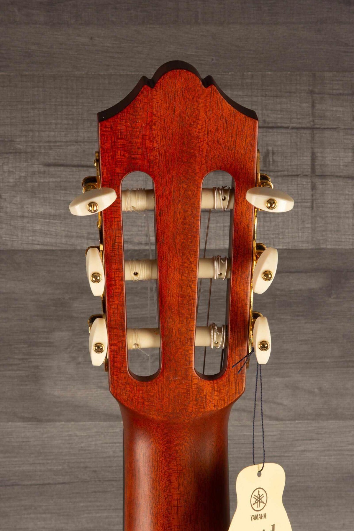 Yamaha CG192C classical guitar headstock with tuning pegs and neck details.