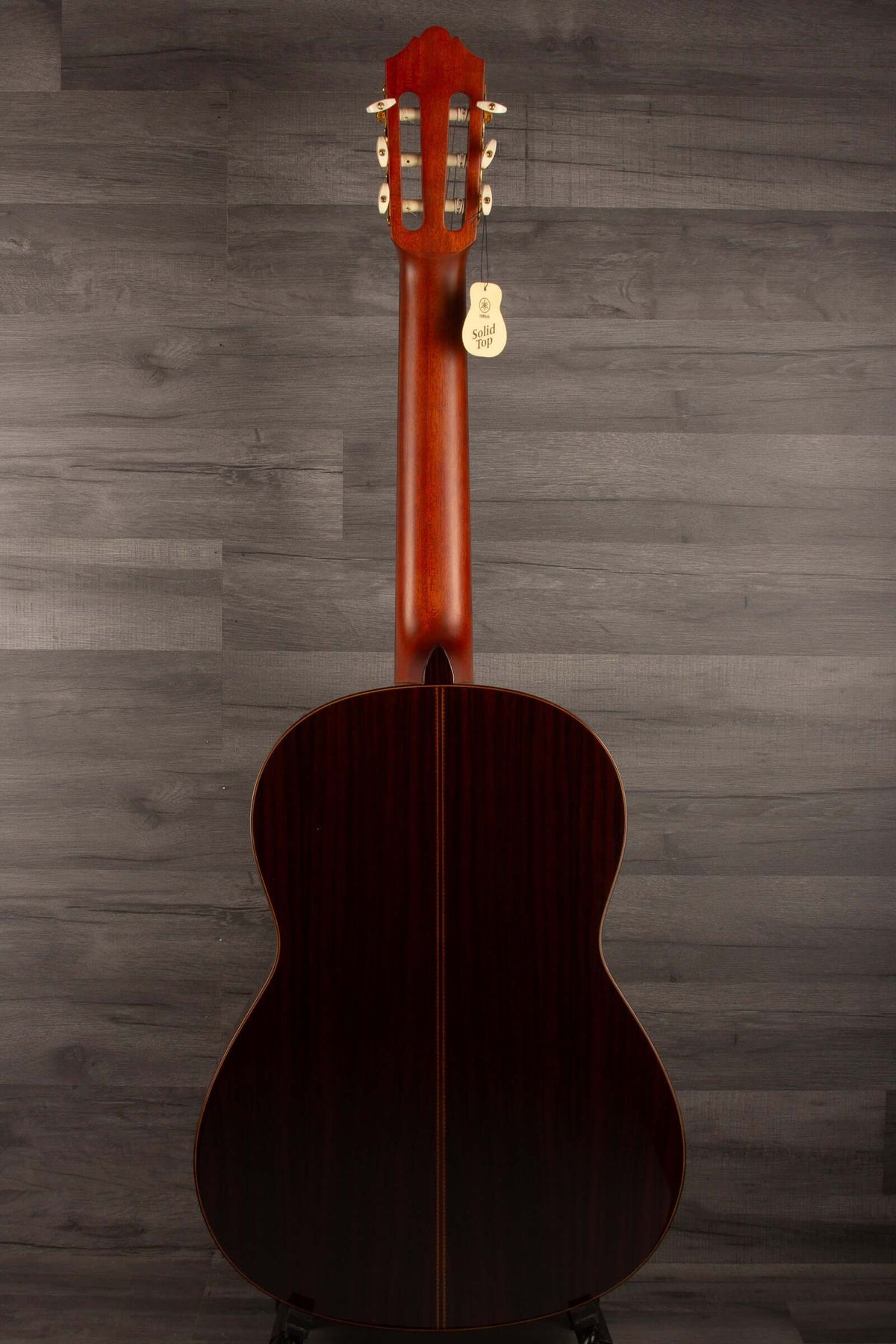 Back view of Yamaha CG192C classical guitar highlighting its sleek design and quality craftsmanship.