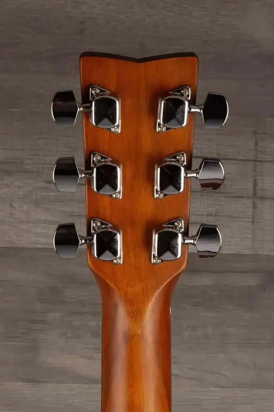 Yamaha F400 Natural Satin guitar headstock showcasing tuning pegs and natural wood finish.