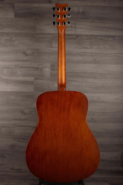 Back view of Yamaha F400 Natural Satin acoustic guitar showcasing its smooth wood finish and classic shape.