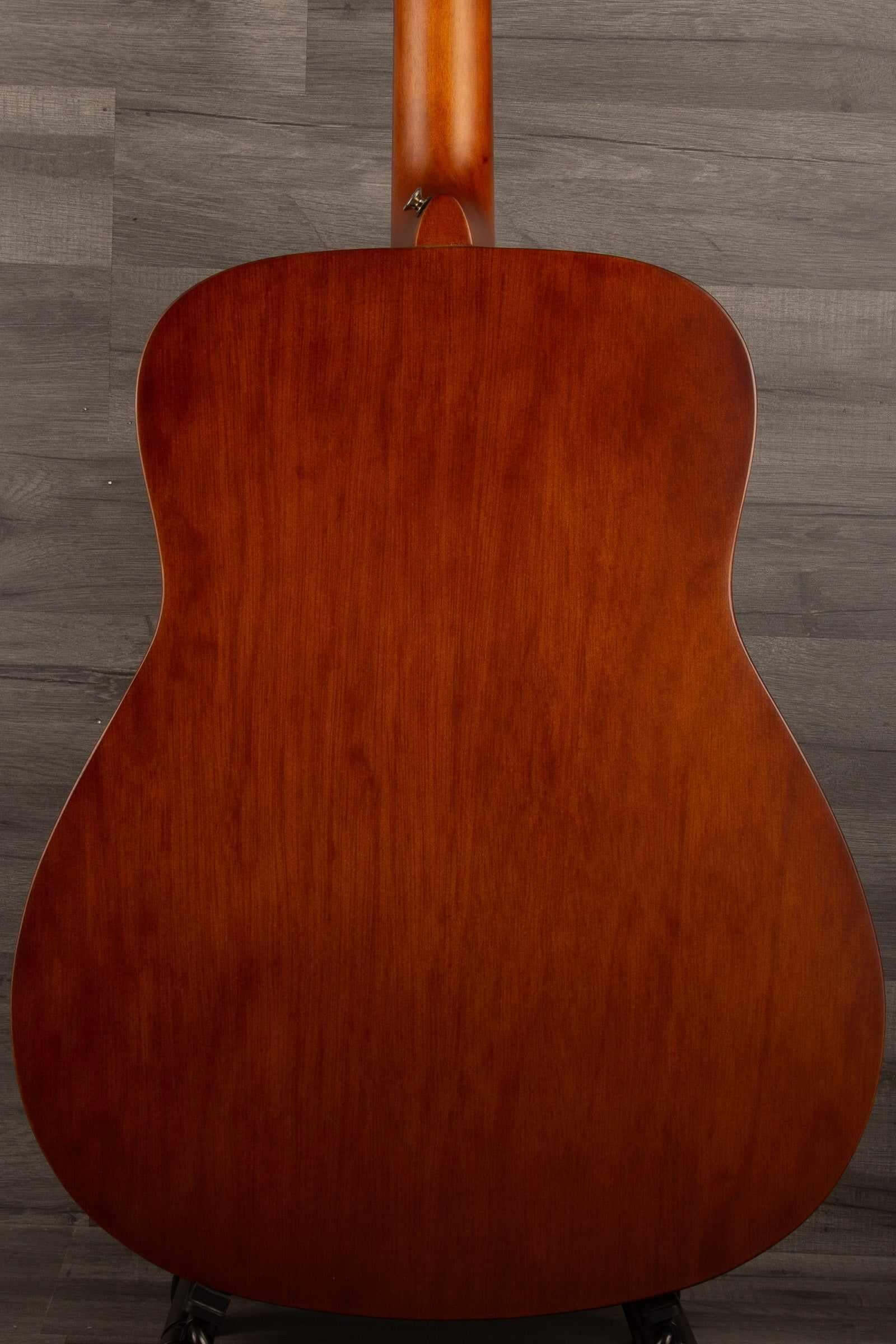 Back view of Yamaha F400 Natural Satin acoustic guitar showcasing the rich wood grain and classic design.