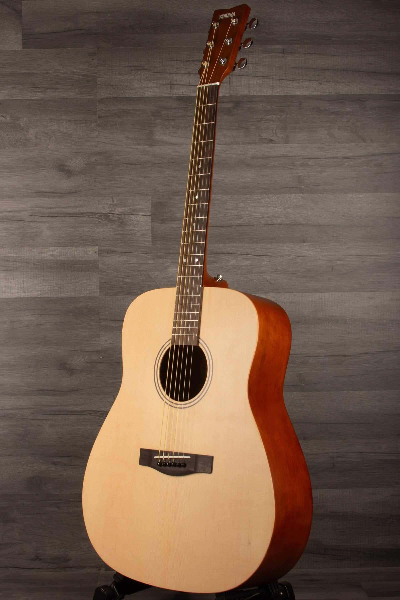 Yamaha F400 Natural Satin acoustic guitar showcasing its natural satin finish and classic design.