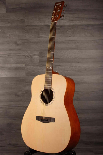 Yamaha F400 Natural Satin acoustic guitar showcasing its natural satin finish and classic design.
