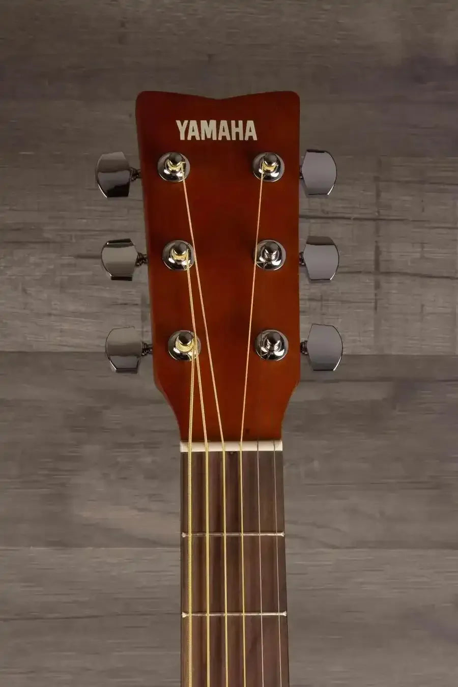 Yamaha F400 Natural Satin acoustic guitar headstock featuring tuning pegs and strings