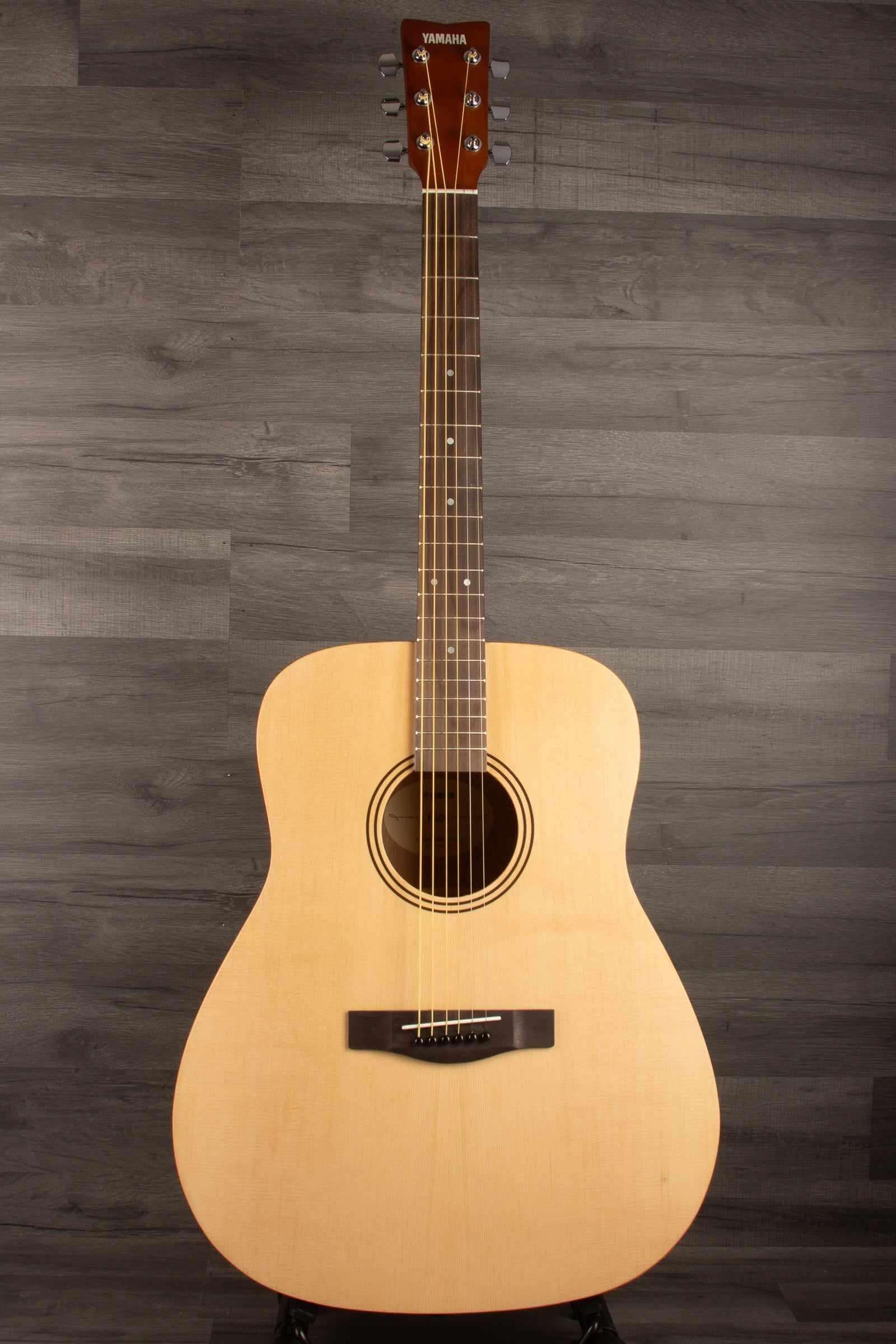 Yamaha F400 Natural Satin acoustic guitar showcasing its natural wood finish and traditional design.