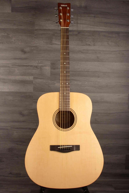 Yamaha F400 Natural Satin acoustic guitar showcasing its natural wood finish and traditional design.