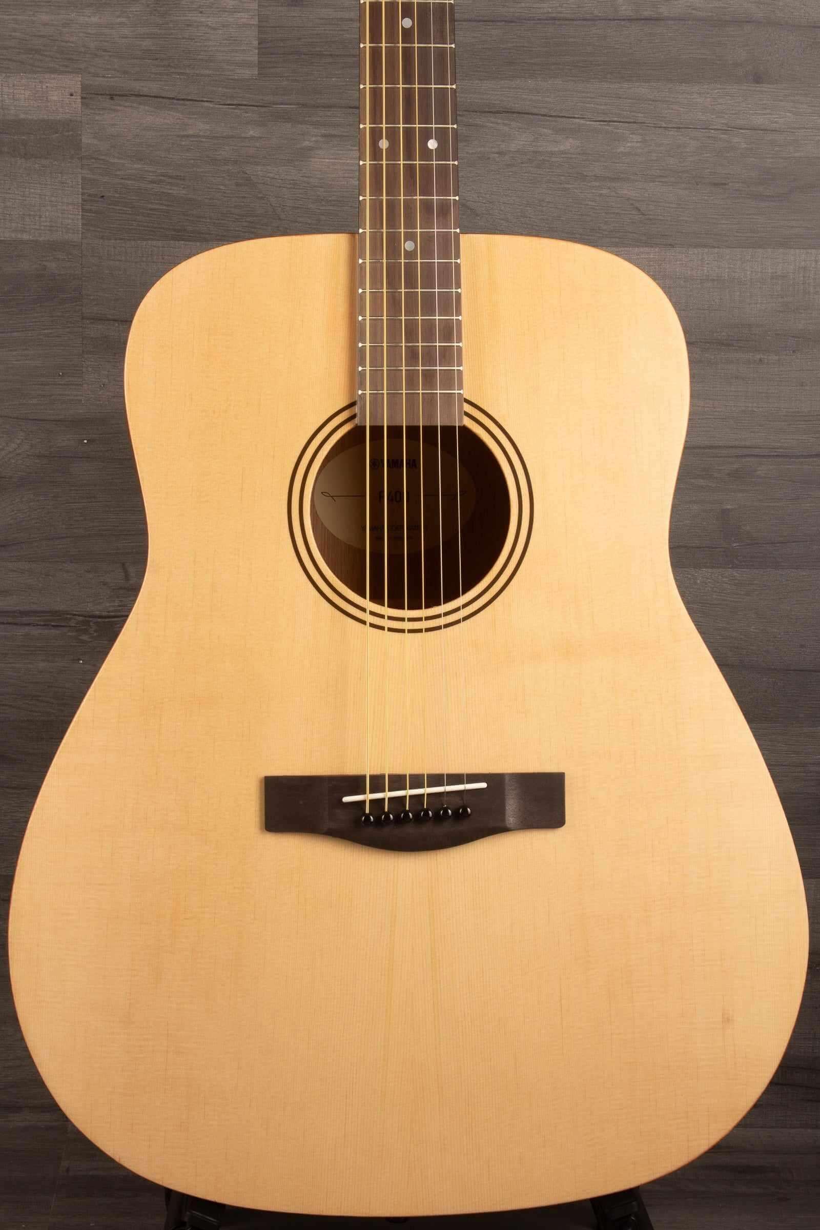Yamaha F400 Natural Satin Acoustic Guitar with a natural finish showcasing its classic dreadnought design.